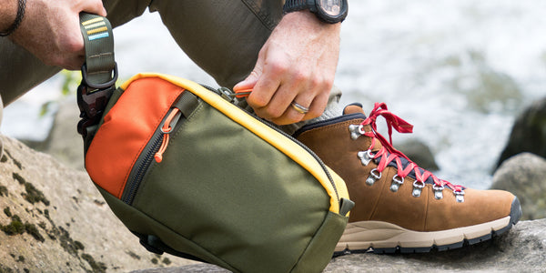 Hayden sling bag shown in olive, orange and yellow