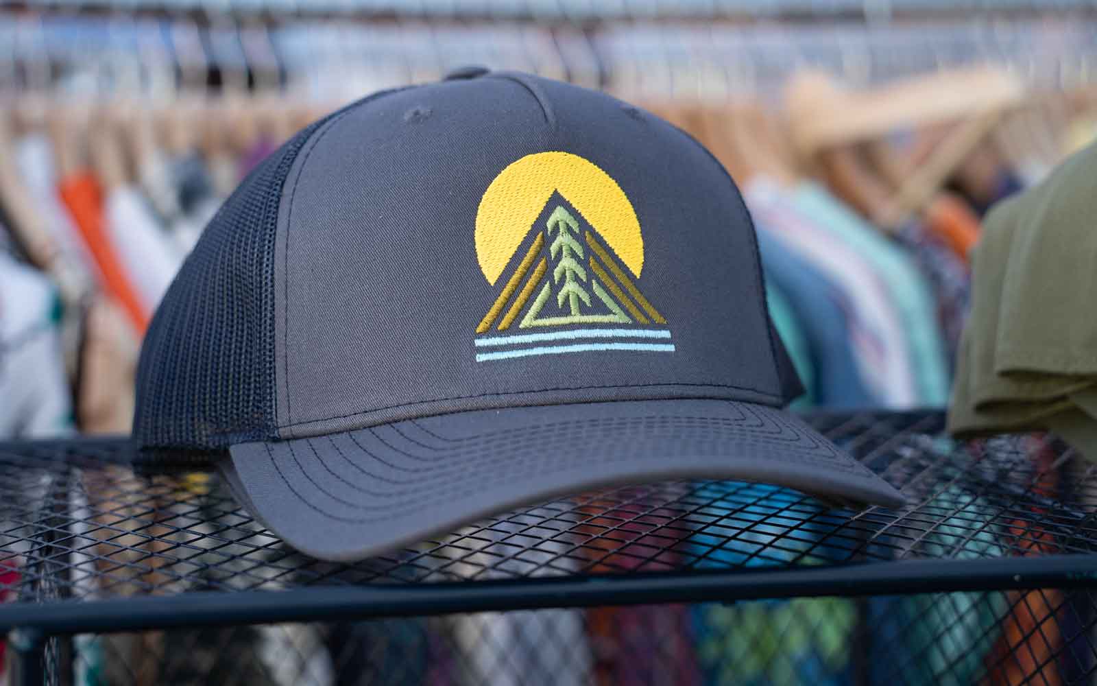 Embordered navy trucker hat featuring our one tree design.  Designed as a tribute to the outdoors – fresh air, clean water, sunshine, and a long hike that makes the soul feel good. 