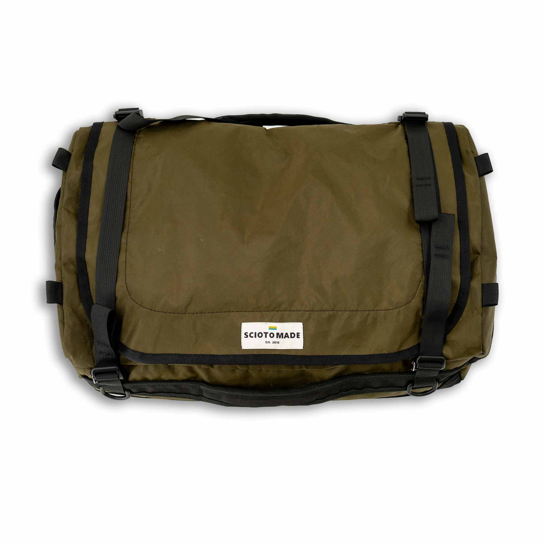 Rockbridge Expedition Small Duffel Bag: Reinforced handles, mesh lid pocket, spacious interior. Padded base for gear safety, adjustable straps. Made in USA with black Mil Spec 1000D Cordura on the bottom, army green 200D EcoPac for the body of the exterior.  Ideal for adventures, meets carry-on limits. 