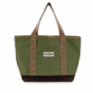 The Darby Tote: Spacious, organized, and durable in olive duck cloth and brown waxed canvas. Coyote interior and straps. Made in the USA. Size: 13" L x 7" W x 12" H.