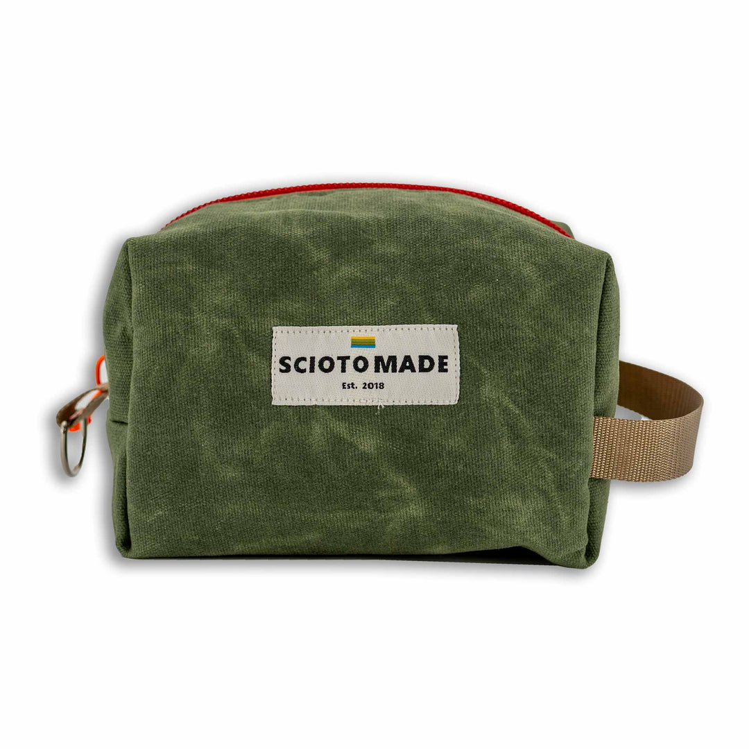 Travel Dopp Kit in green waxed canvas: Spacious, easy-to-clean, sturdy build. Made in the USA with durable materials. Perfect for travel & organization.