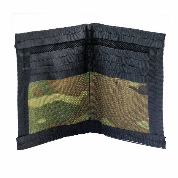 Camo bifold wallet with black trim. Made to hold 8 to 12 cards and has a 2" exterior elastic cash strap on the back. Inside view showing card slots.  Inside is camo and black.