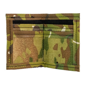 Camo bifold wallet with camo trim. Made to hold 8 to 12 cards and has a 2" exterior elastic cash strap on the back. Inside view showing card slots.