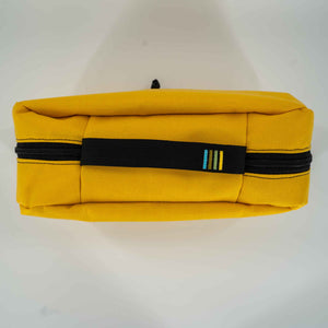 This 4L yellow packing cube is made with durable 1000D Cordura and lined with bright 400D pack cloth.  Inside there are two internal mesh pockets to make organization simple. Top View showing exterior handle with the Scioto Made stripes embroidered on it.  