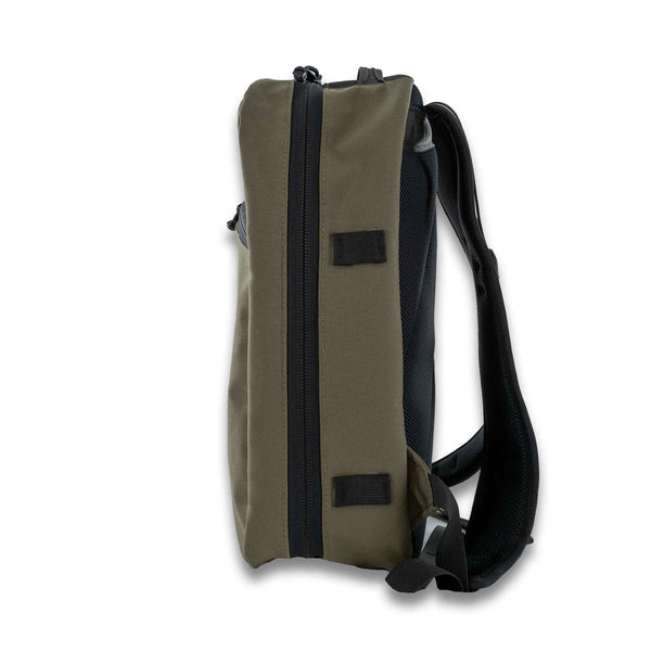 This 21L backpack is made from Mil Spec 1000D Cordura in Ranger Green and is perfect for carrying all your essentials. Side View.