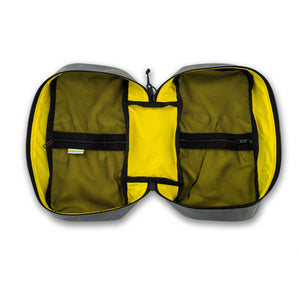 Interior view of the 4L packing cube. Yellow inside with black mesh.  Two interior zipped mesh pockets.