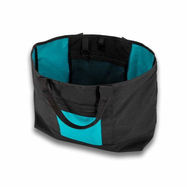 Scioto Made Boat Tote.  Outside colors black main body and teal pocket.  Interior color is teal.  Showing interior mesh pocket.