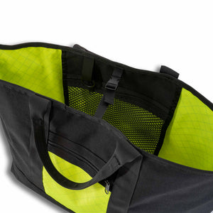 Scioto Made Boat Tote. Outside colors black main body and yellow pocket. Interior color is yellow. Showing interior mesh pocket.                                             
