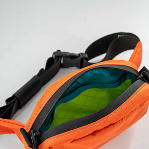 1L Hip Pack shown in orange inside view.  The inside is yellow and teal.