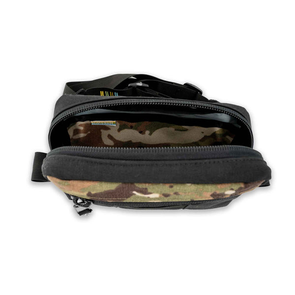 The Lane Sling Bag - where durability meets functionality for your everyday journey. Handcrafted with durable black and camo 1000D Cordura this sling bag will last years to come. Inside view showing pocket.