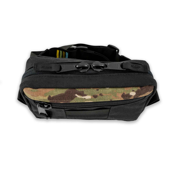The Lane Sling Bag - where durability meets functionality for your everyday journey. Handcrafted with durable black and camo 1000D Cordura this sling bag will last years to come. Top view showing zipper closure.