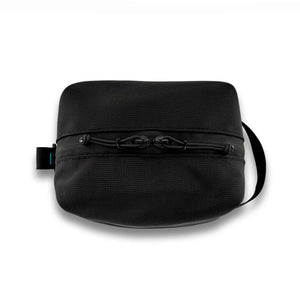Handmade with premium materials this dopp kit is built to last throughout your travels and beyond. It will hold all your essential toiletry and accessory needs with ease.  Made with an aqua guard zipper to protect your items from the elements while exploring the great outdoors. Outside material is 1050D Ballistic Nylon in black.  The inside is lined with yellow pack cloth. Made in Ohio.